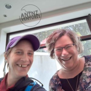 A selfie of Antnz on left, wearing a purple cap. On the right is Rachel Nobel. Both are smiling at the camera