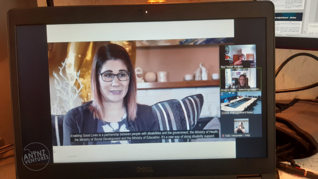 A picture of a laptop screen. This screen is taken from a Zoom meeting. The main screen shows a woman with shoulder length hair. 4 participant screens can be seen to the right of screen.