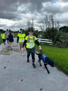 Antnz and ADNZ Raven are walking slightly ahead of Wendy, they are walking on the right hand sight of the picture, and pathway. Behind them on the left of the path and picture you can see other runner and walkers backs, including a bright yellow Achilles t-shirt
