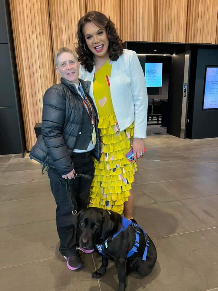Antnz and Mary Haddock-Stanliard with ADNZ Raven sitting in front of them