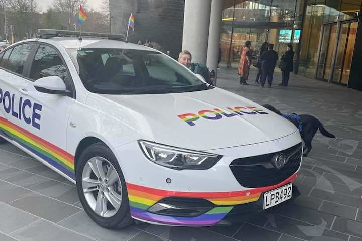 A NZ Police car that has Rainbow lettering and a rainbow around the bottom panels. Antnz and Raven can just be seen behind the car.